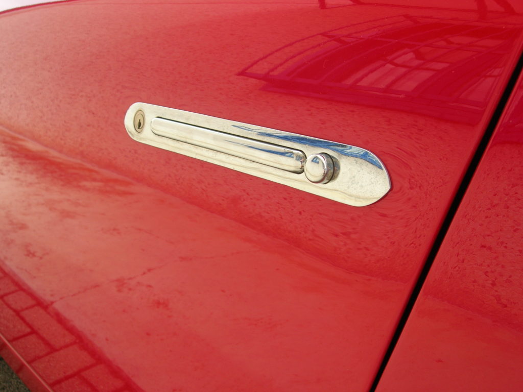 Pair of chrome outside “flush” Zagato door handles. One handle is supplied with locking key